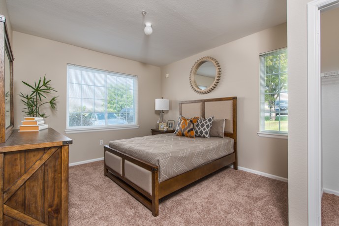 Bedroom with bed, dresser, and window at Peakview at T-Bone Ranch.